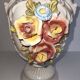 Vintage Italian white ceramic vase with raised floral decoration.