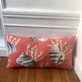 Coral and shell cushion