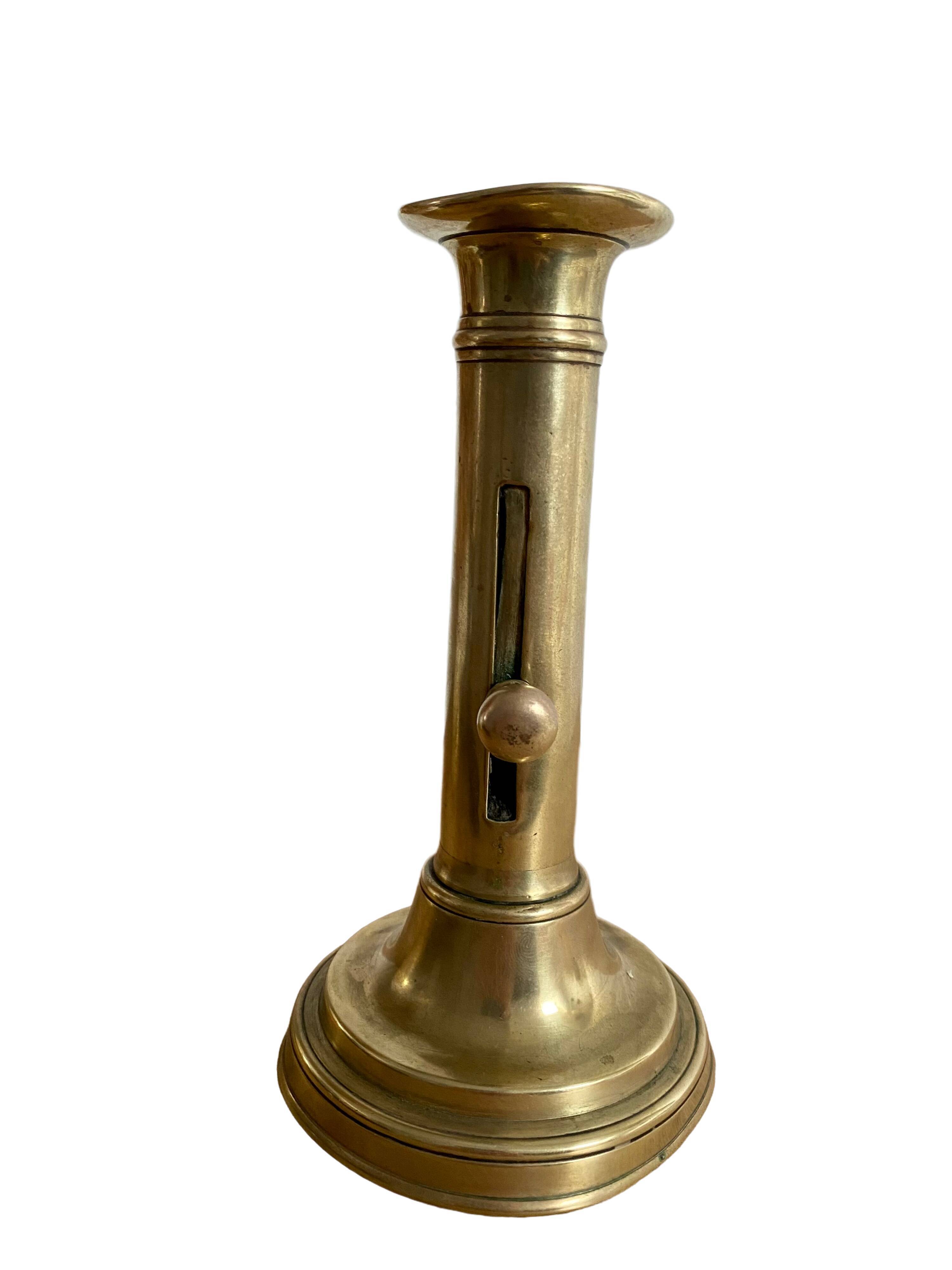 Nineteenth-century brass pull-out candle holder