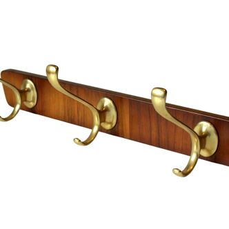 Mid Century wall mounted coat rack made of wood with 3 brass hooks, vintage from the 1950s