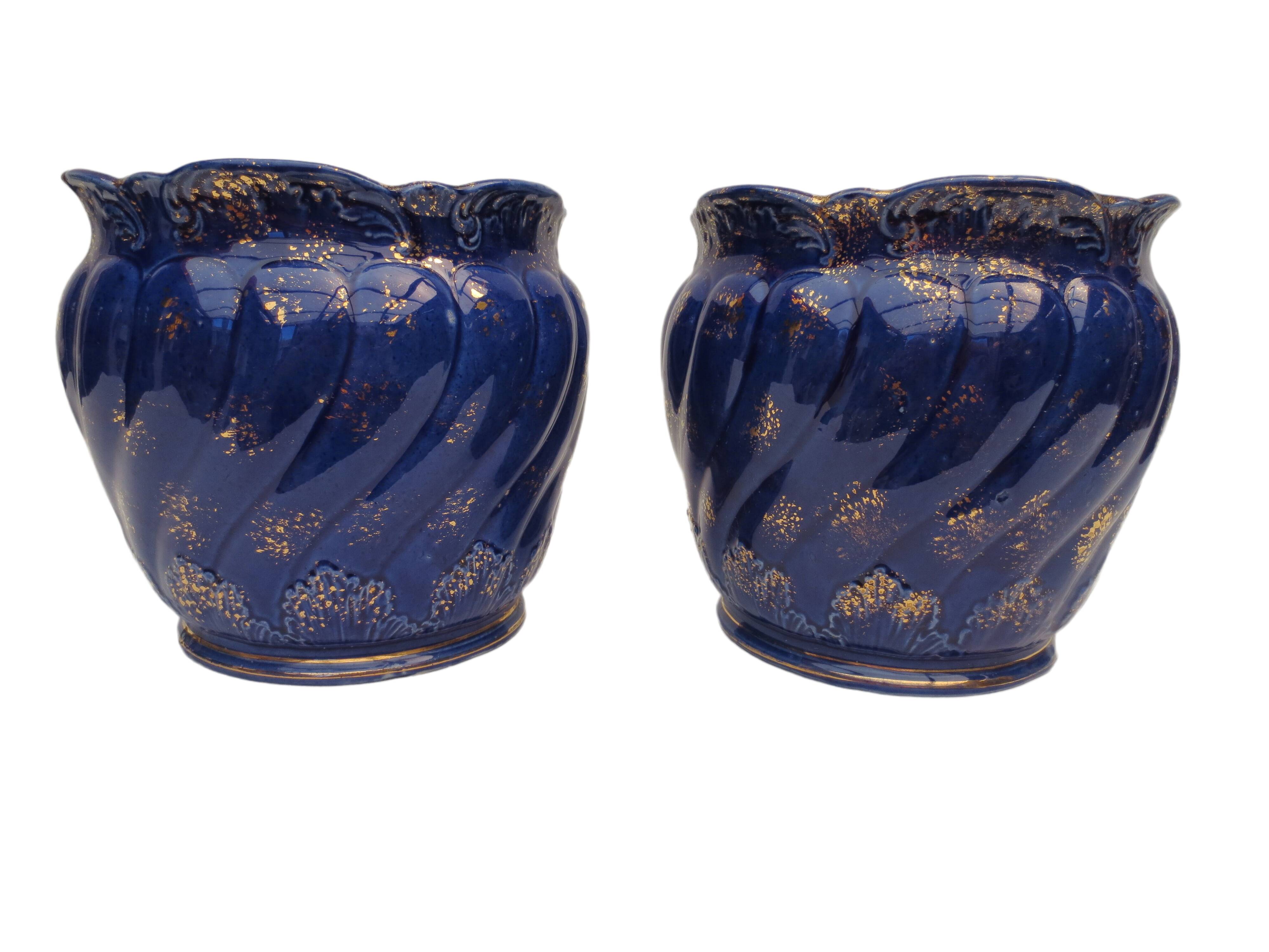 Pair of cache-old pots in midnight blue and gold ceramic