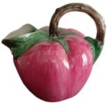Pink pitcher in the shape of a strawberry, Italian slurry.