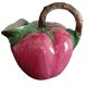 Pink pitcher in the shape of a strawberry, Italian slurry.
