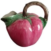 Pink pitcher in the shape of a strawberry, Italian slurry.