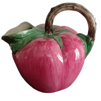 Pink pitcher in the shape of a strawberry, Italian slurry.
