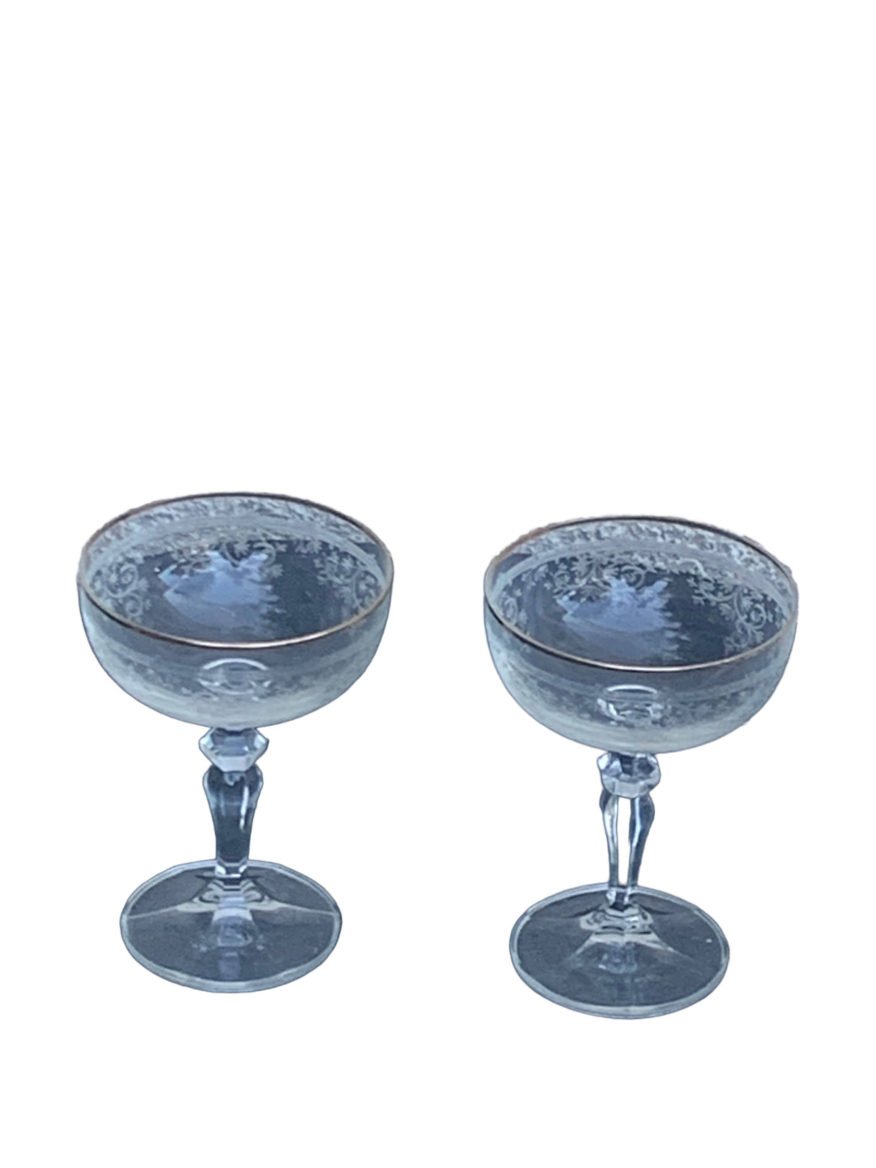 Two crystal champagne glasses and gilded borders antique engraved pattern