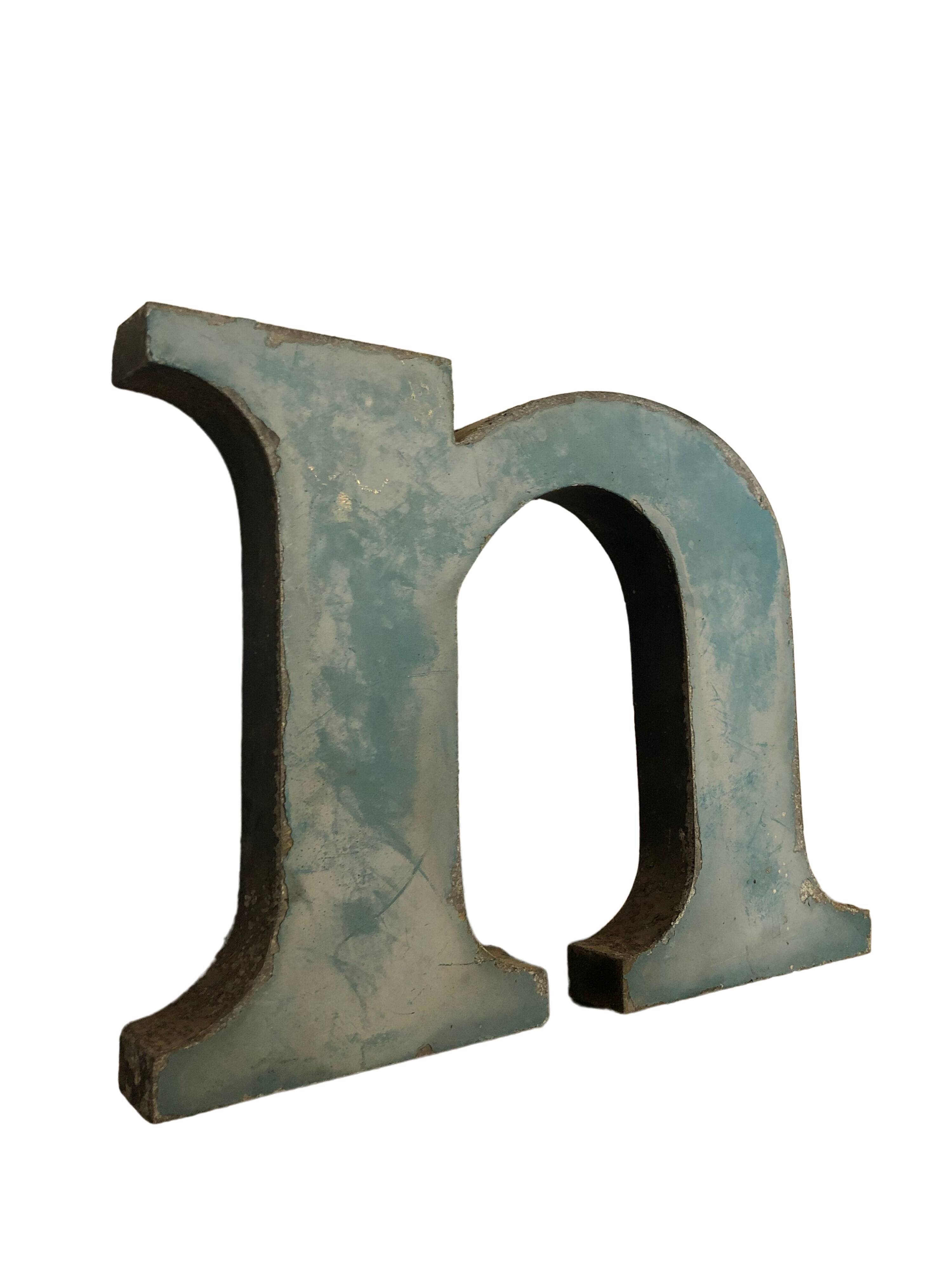 Blue metal letter "N"