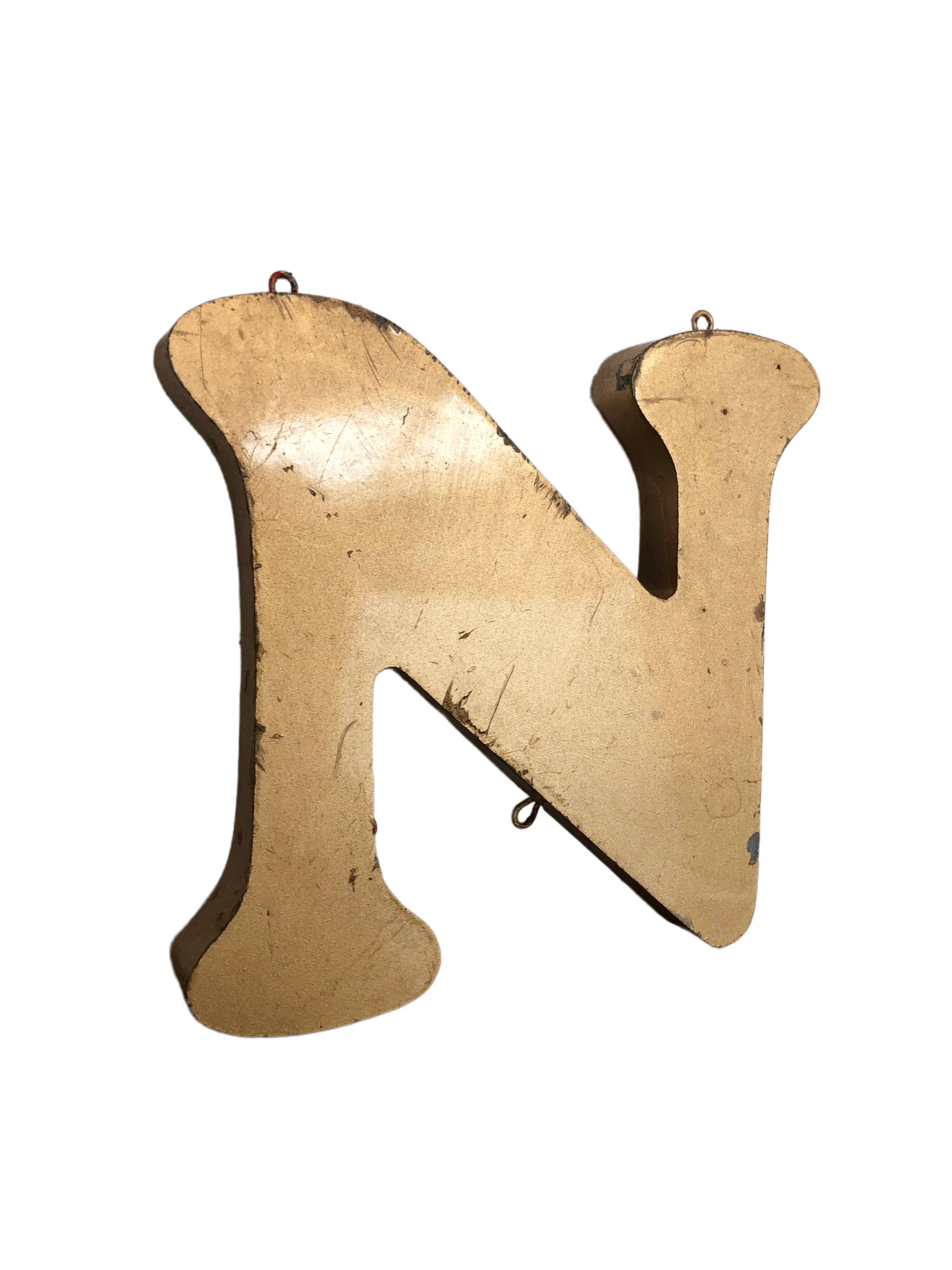 Golden sign letter "N"