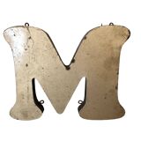 Golden sign letter "M"