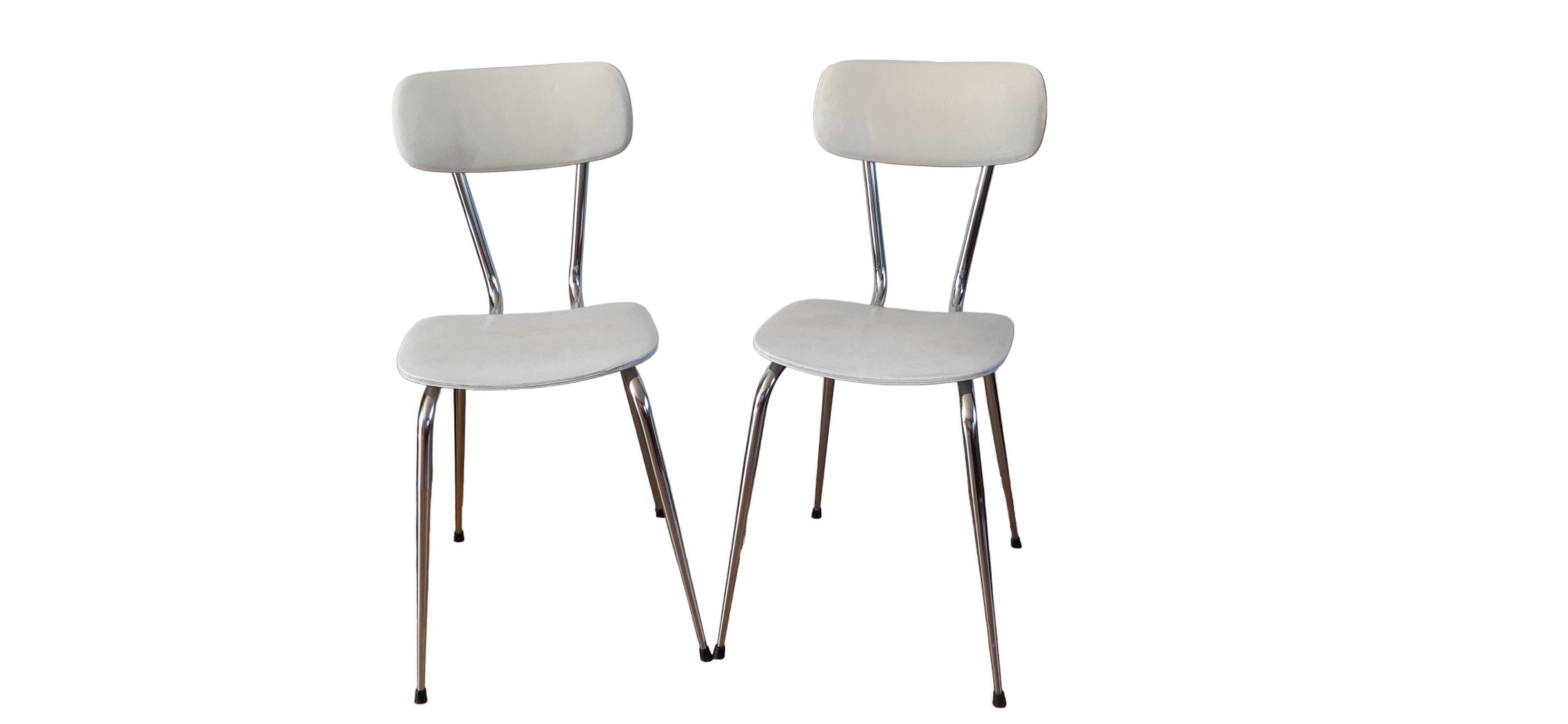 Duo of chairs in skaï, 60-70s