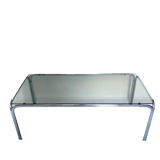 Metal table and smoked glass