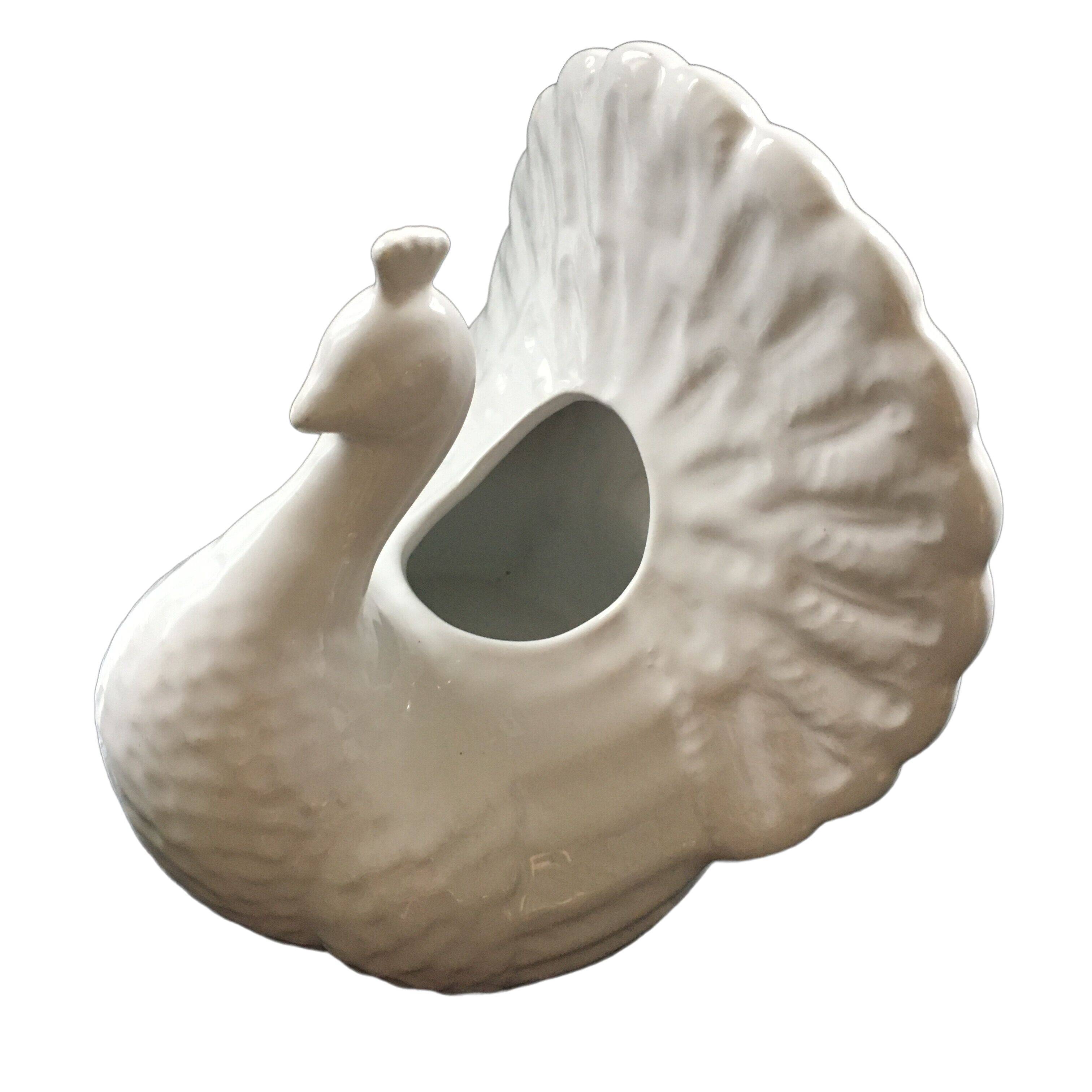White peacock vase