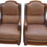 Pair of aged leather armchairs with seat and firm backrest with cherry wood frame