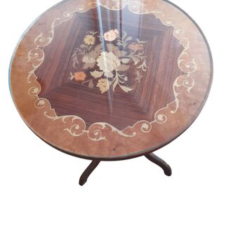 Inlaid wooden pedestal table and its glass top
