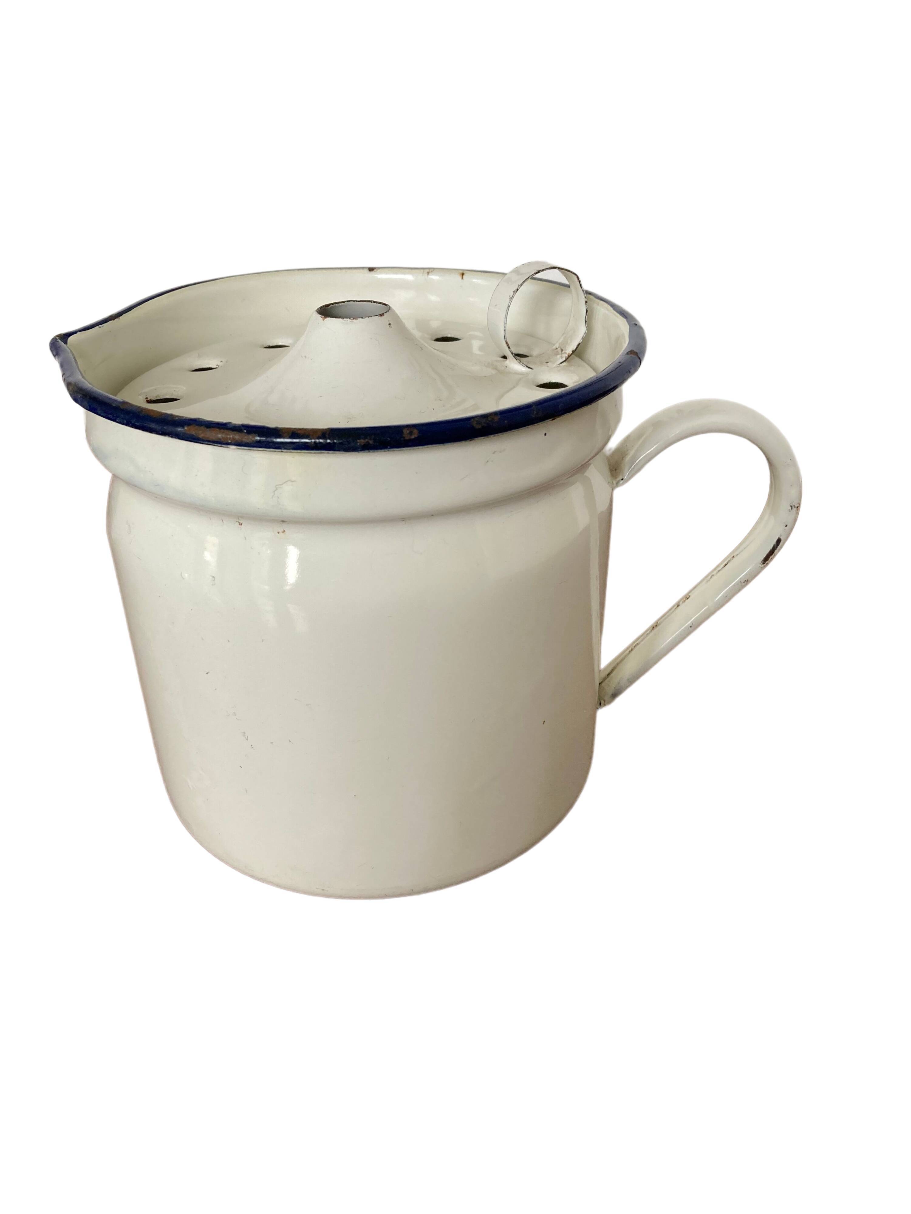 Vintage enamelled iron pitcher