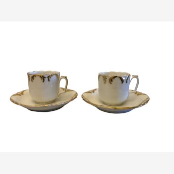 Set of two porcelain coffee cups with golden decoration