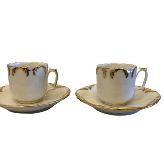 Set of two porcelain coffee cups with golden decoration