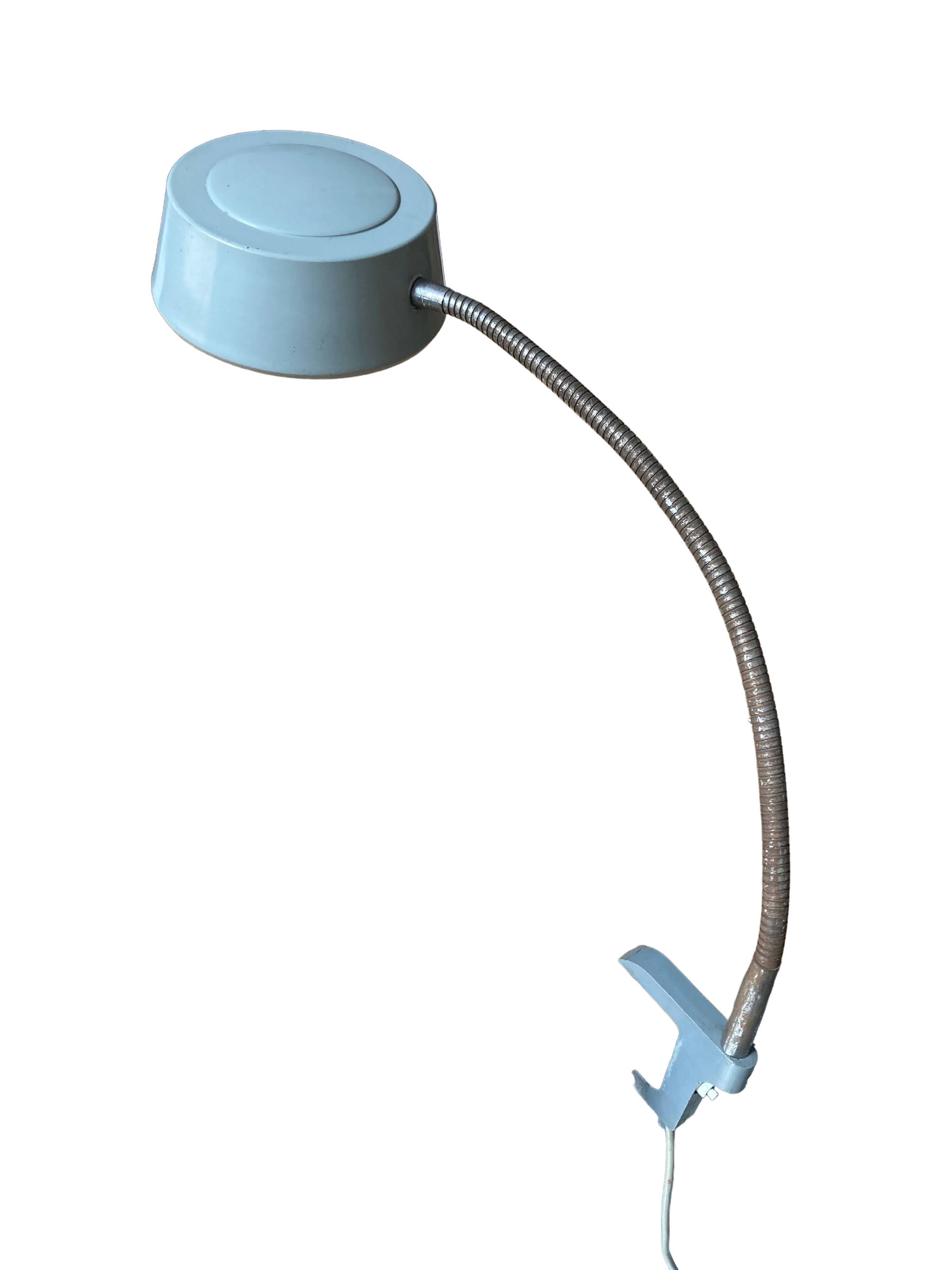 Workshop lamp on ringed metal hose