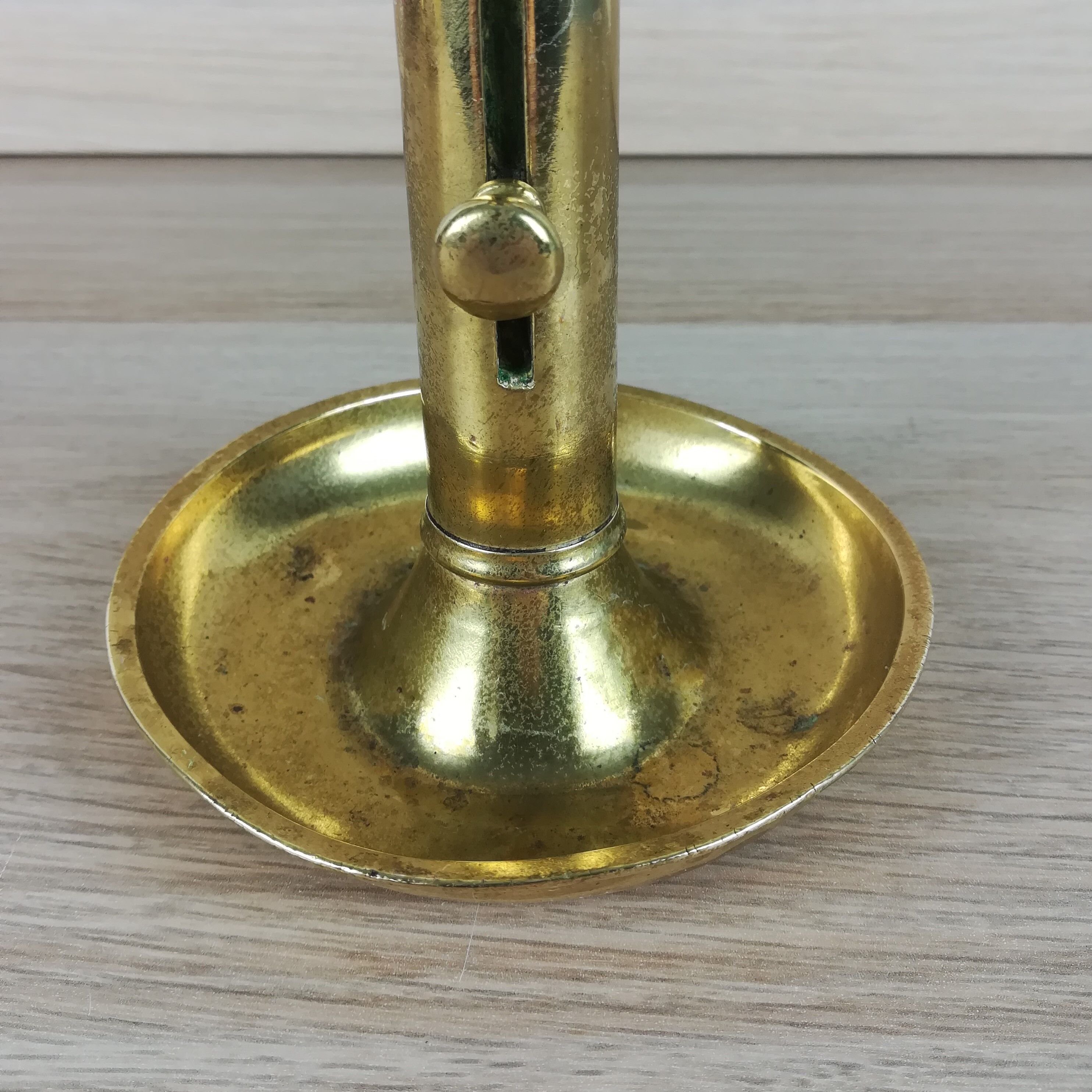 Brass pusher candle holder