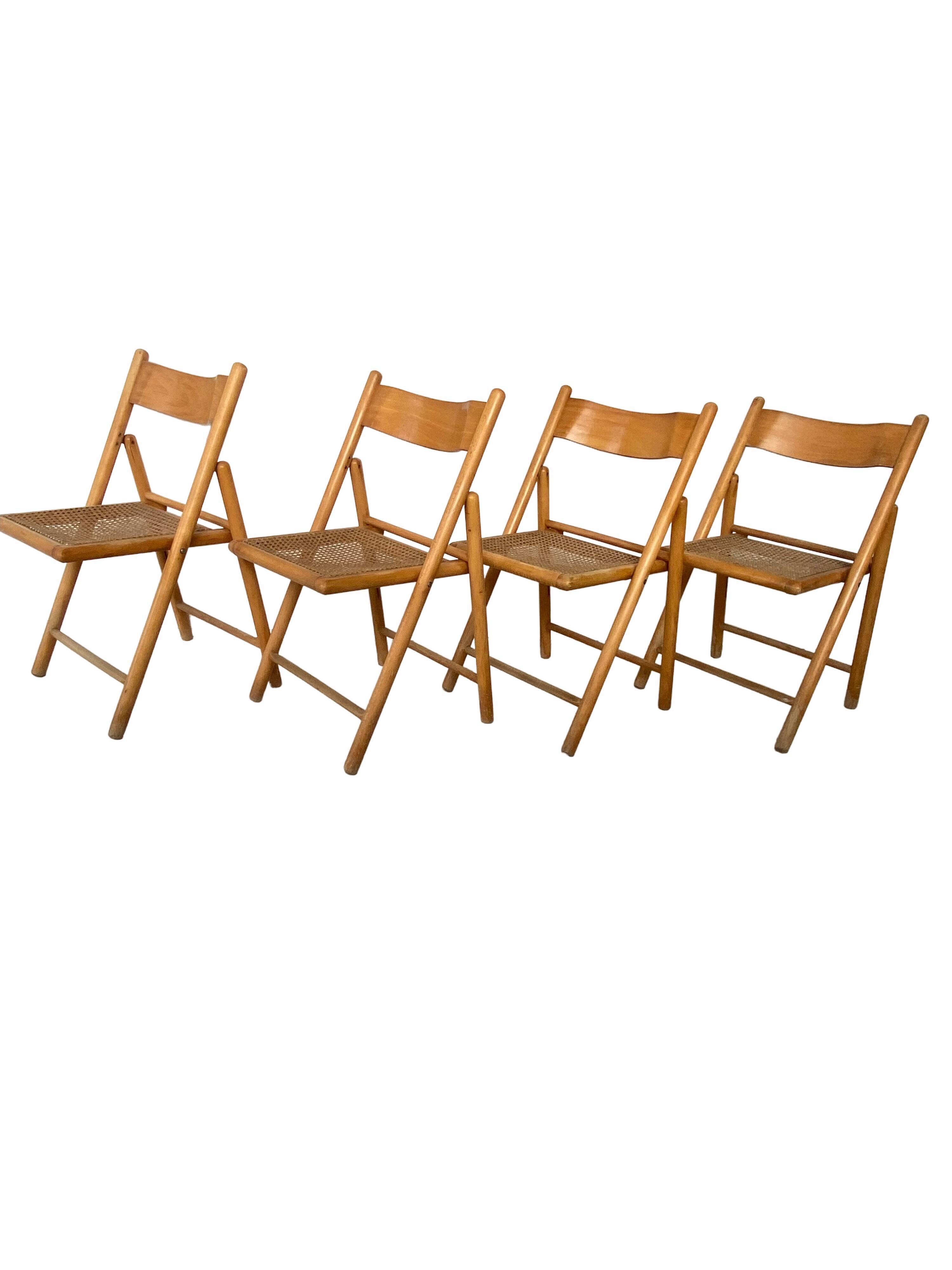 Set of 4 folding chairs, vintage design, wooden structure and canned seat. Around 1970