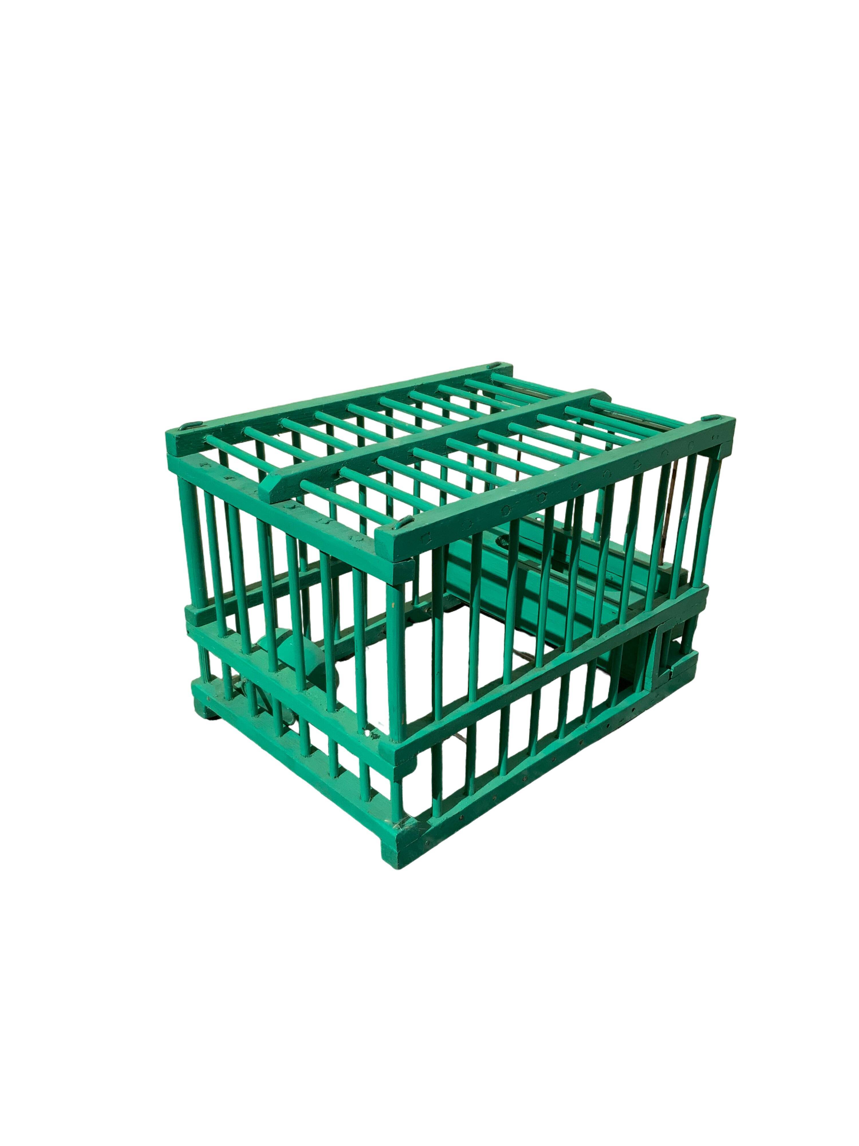 Vintage bird cage in green wood retro paint