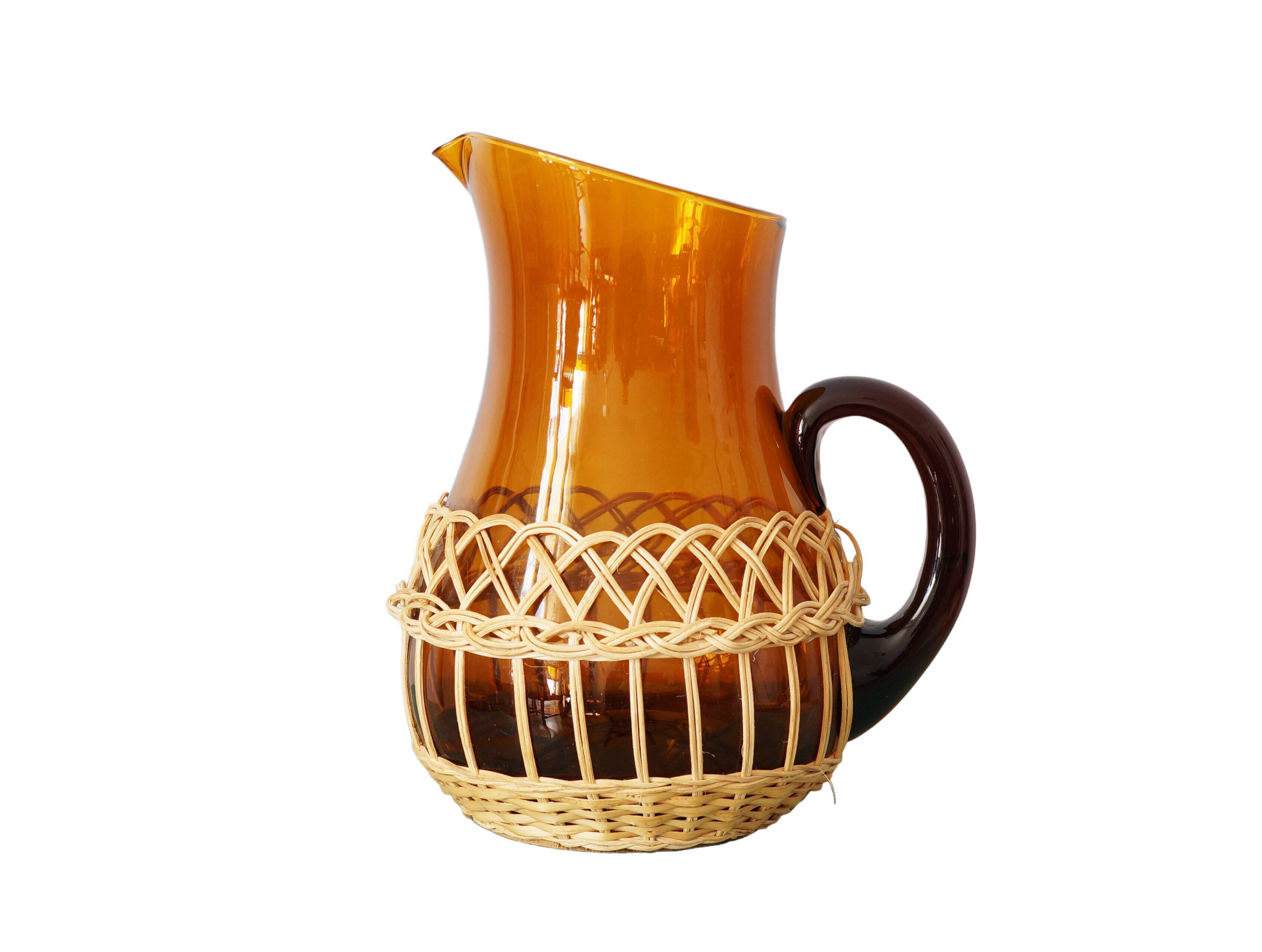 Amber glass decanter dressed in wicker, vintage
