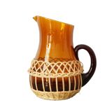 Amber glass decanter dressed in wicker, vintage