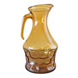 Amber glass pitcher decorated