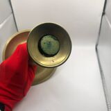 Candle holder with a pusher