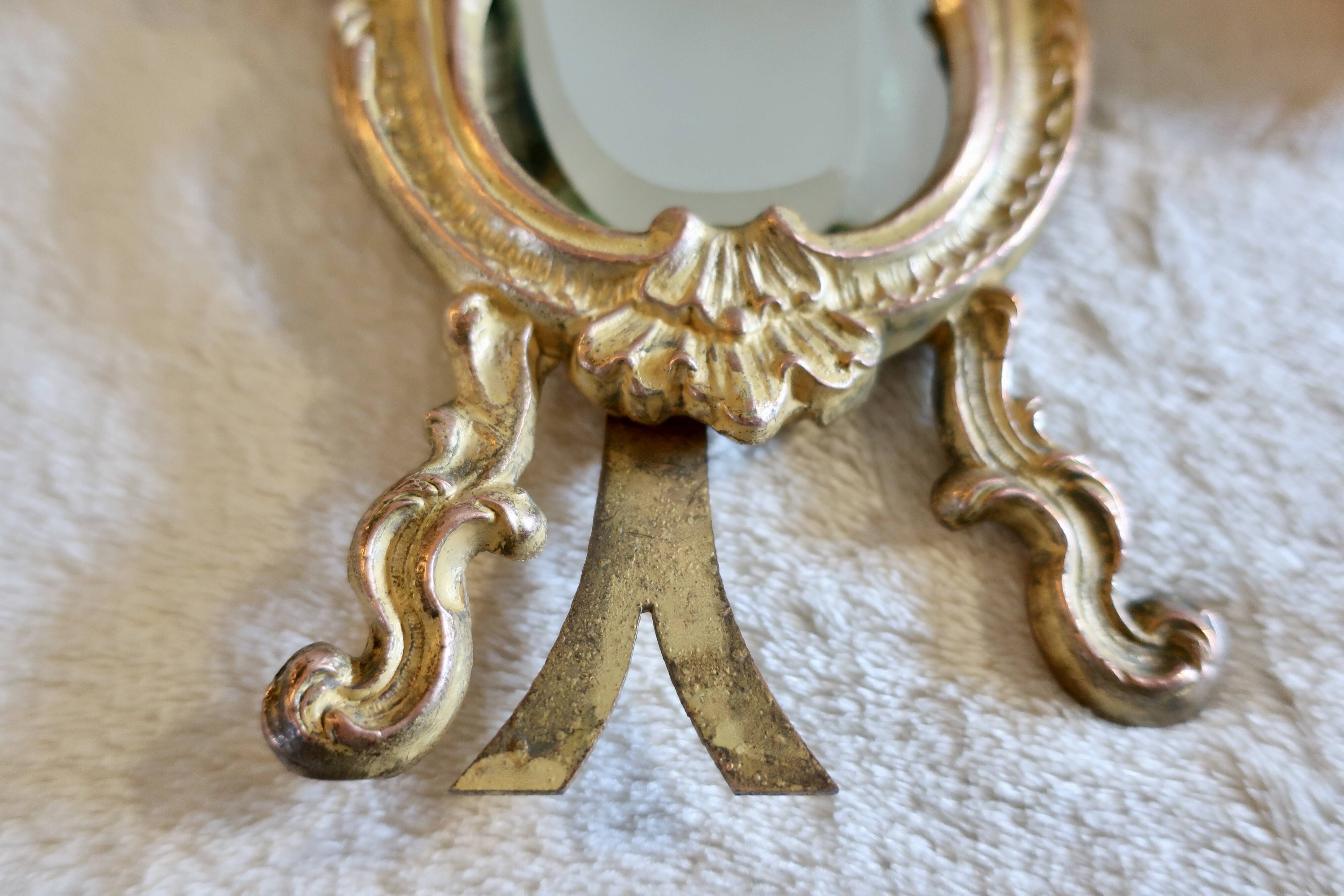 Small vintage 19th century mirror or hand mirror, bronze, beveled glass, baroque, rococo style.