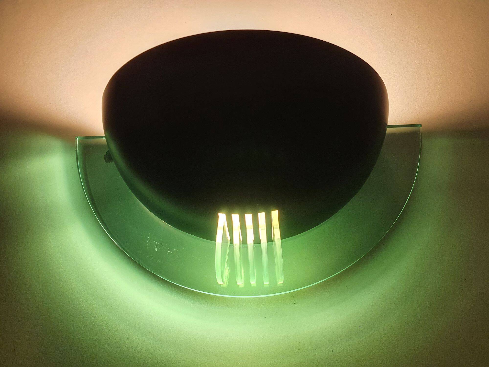 Pair of vintage black metal and plexiglass half-moon wall lights