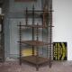 Napoleon III spool shelf, floor-standing shelf with brass tips.