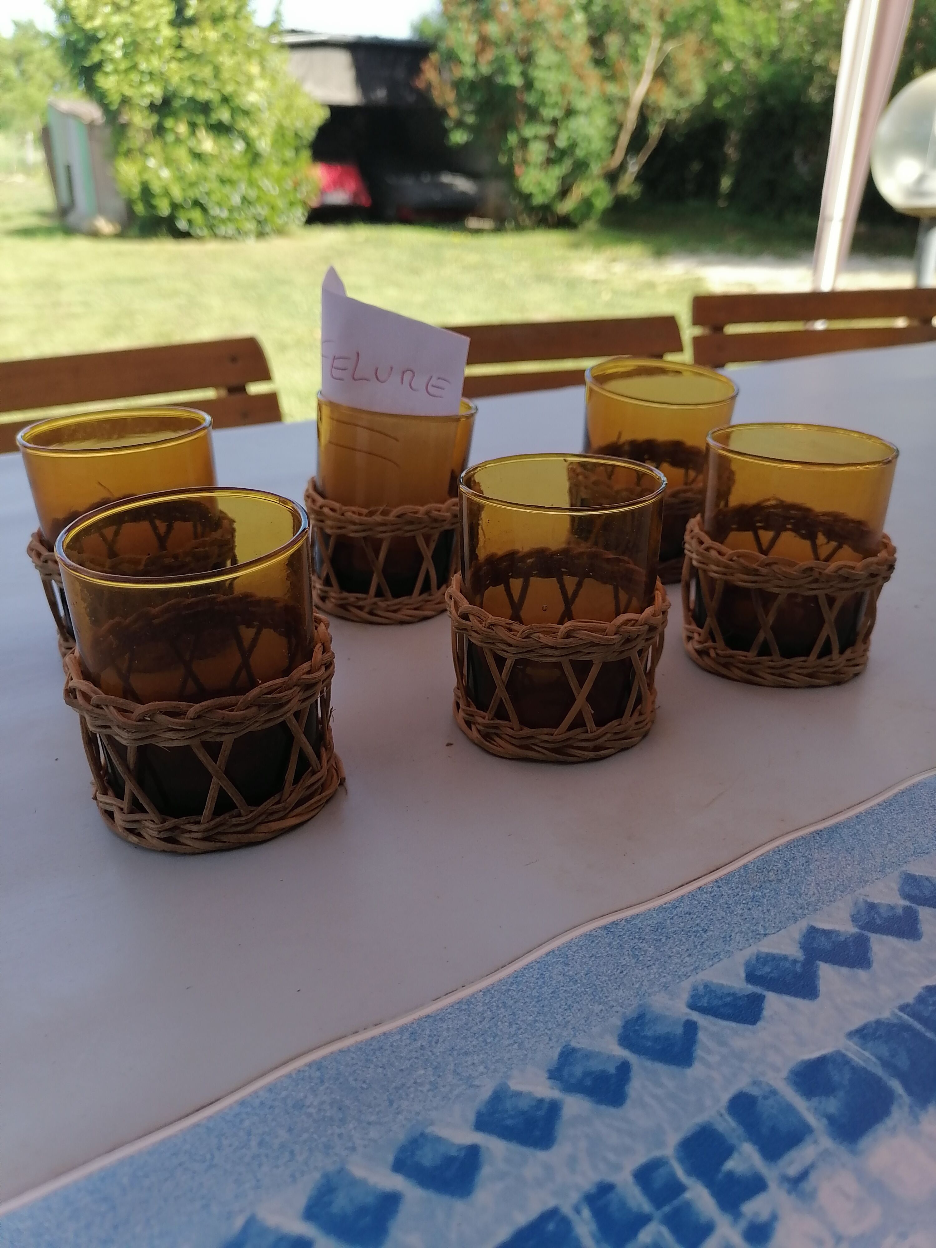 6 small glasses Amber Blown Glass garnished wicker 1 cracked
