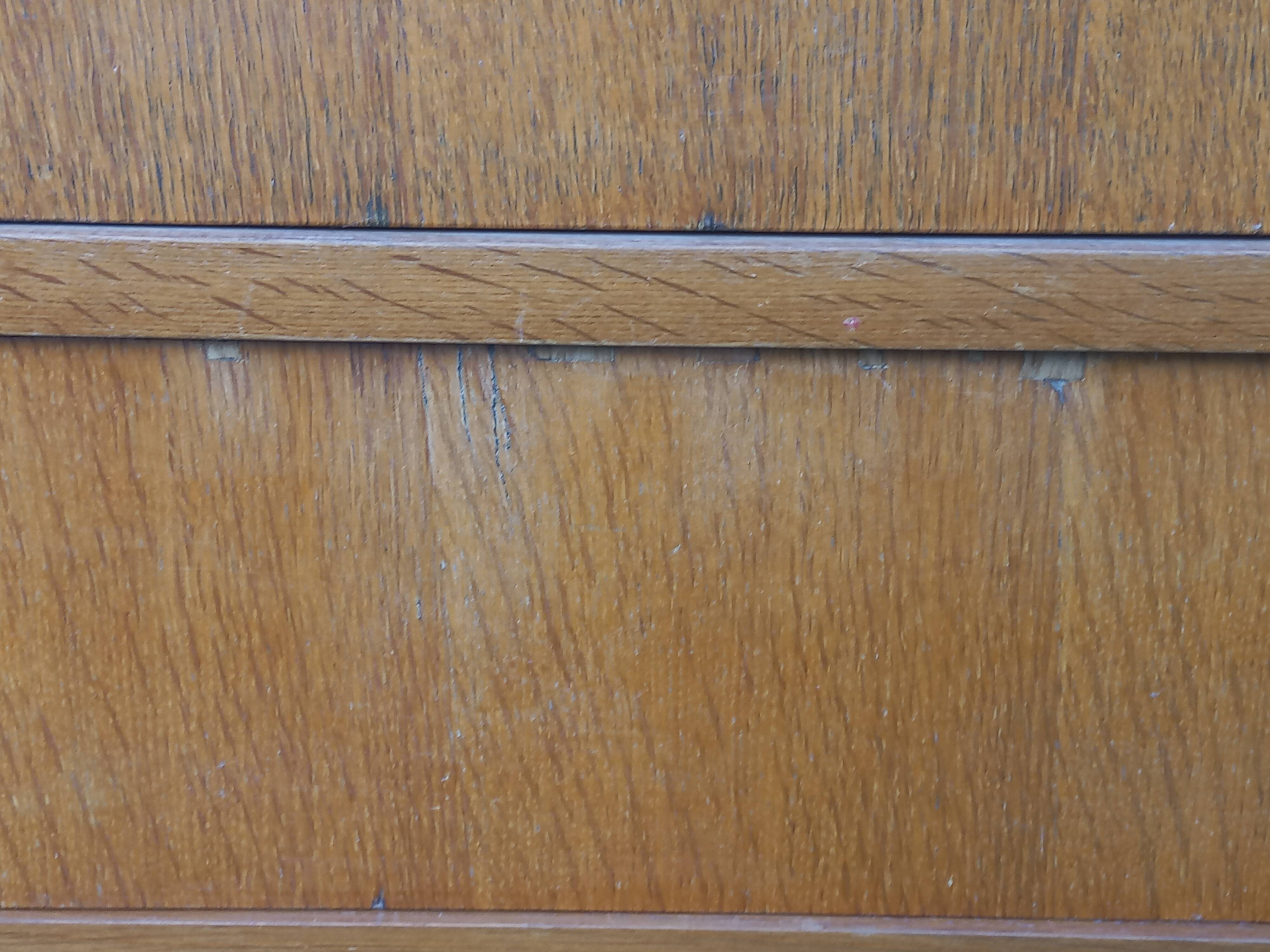Vintage oak commode with tapered legs and wings from the 1950s.