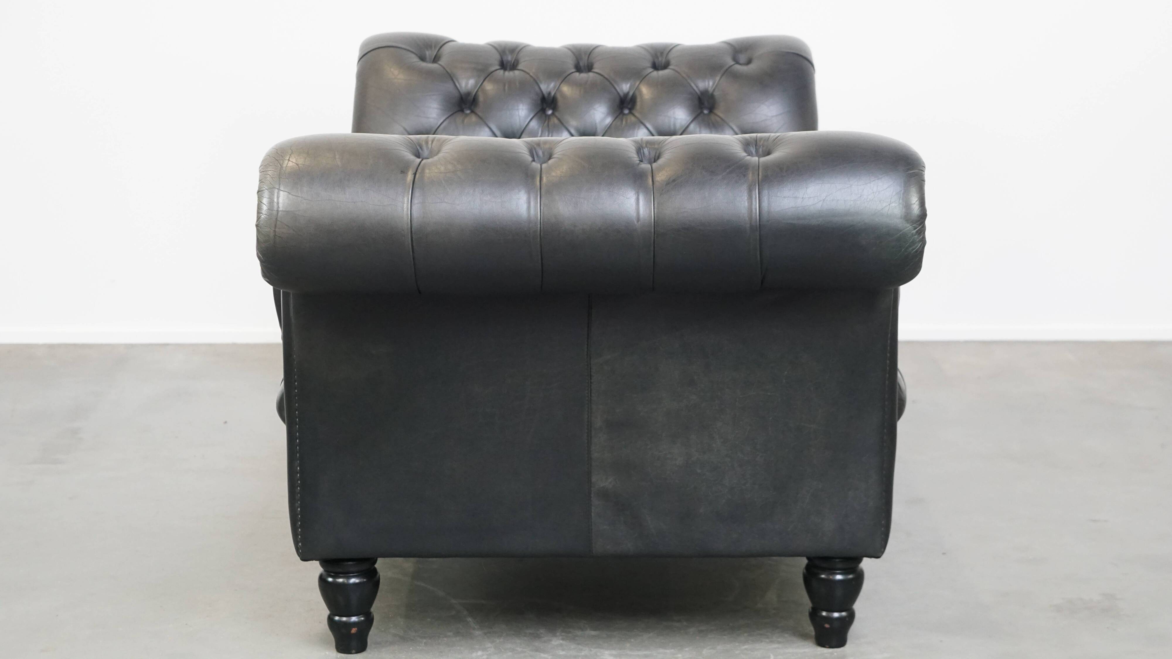 Black chesterfield daybed made of cowhide