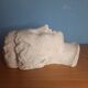 Antique plaster face of a woman