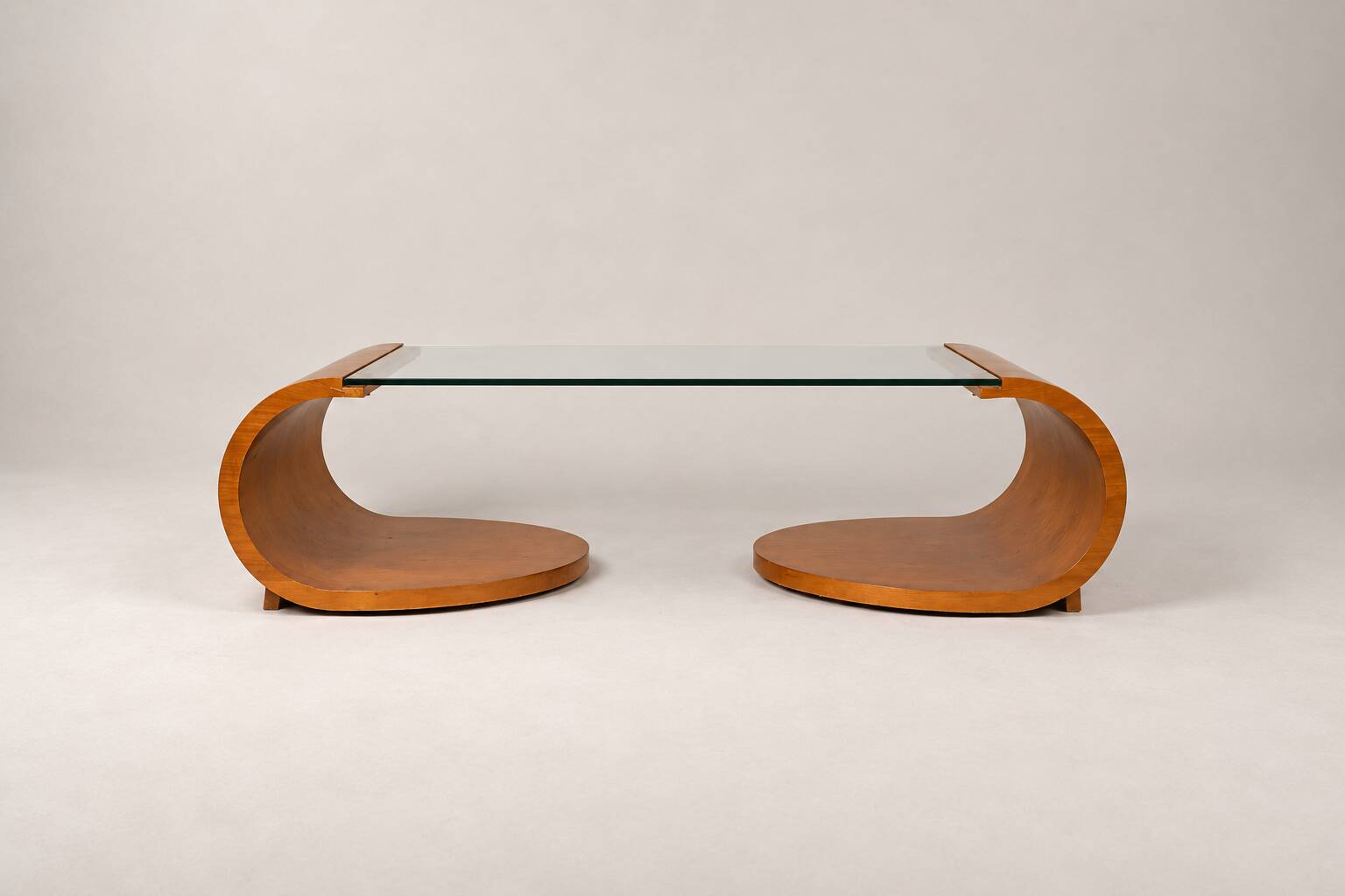 Sculptural coffee table in wood and glass — circa 1970