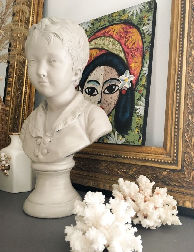 Cherub bust in platter