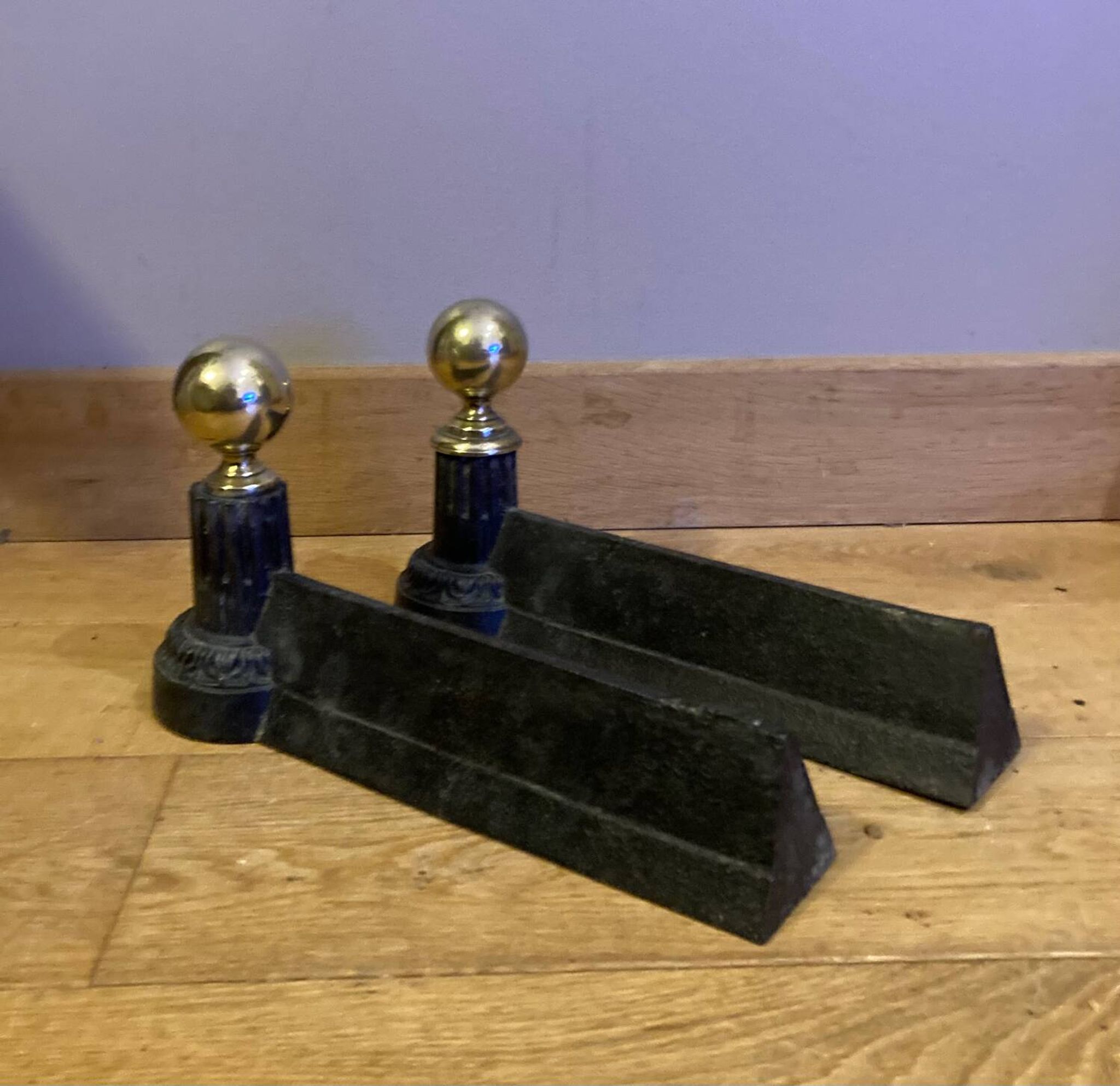 Pair of Napoleon III andirons from the 19th century in cast iron and brass