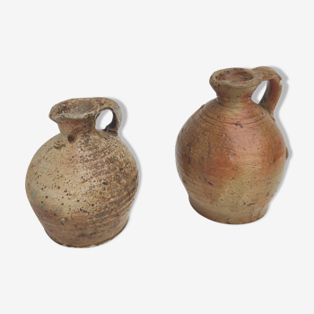 Set of two small sandstone pitchers