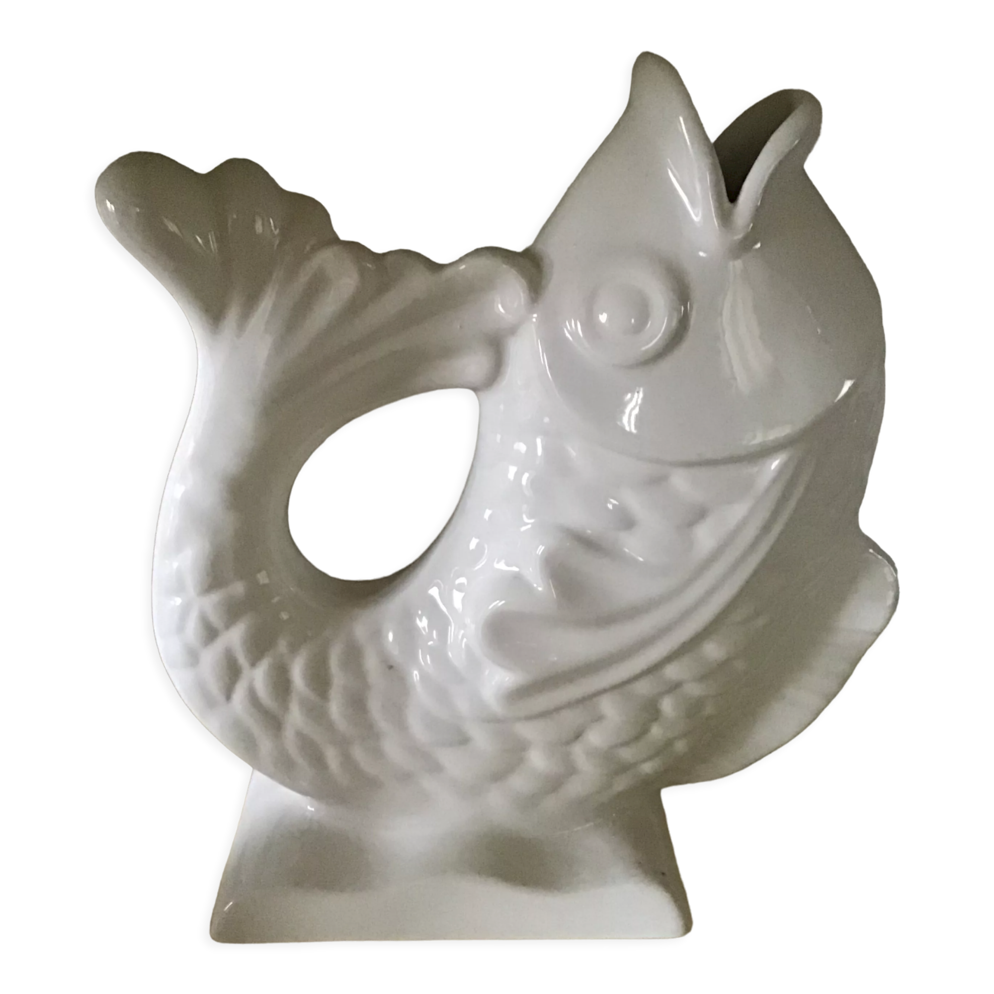 White ceramic vase in the shape of fish