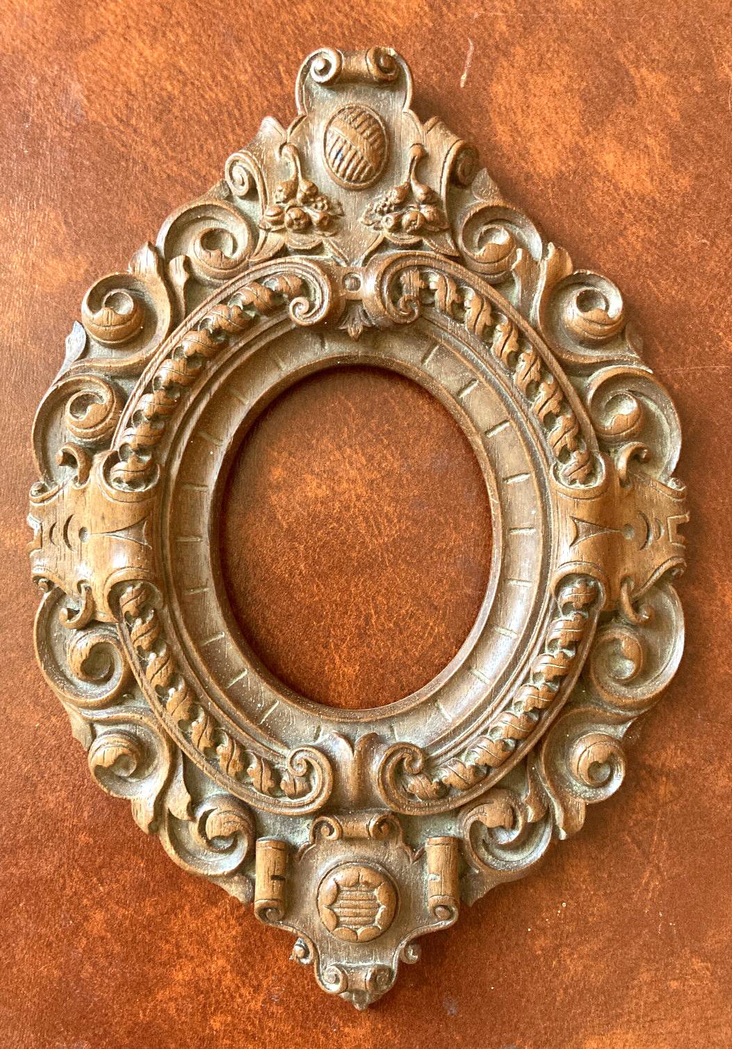 Carved oval wooden frame