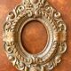 Carved oval wooden frame