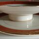 Plate and limoges porcelain dish with orange and gold trim