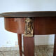 Empire guéridon table in mahogany with a black marble top and gilded bronze.