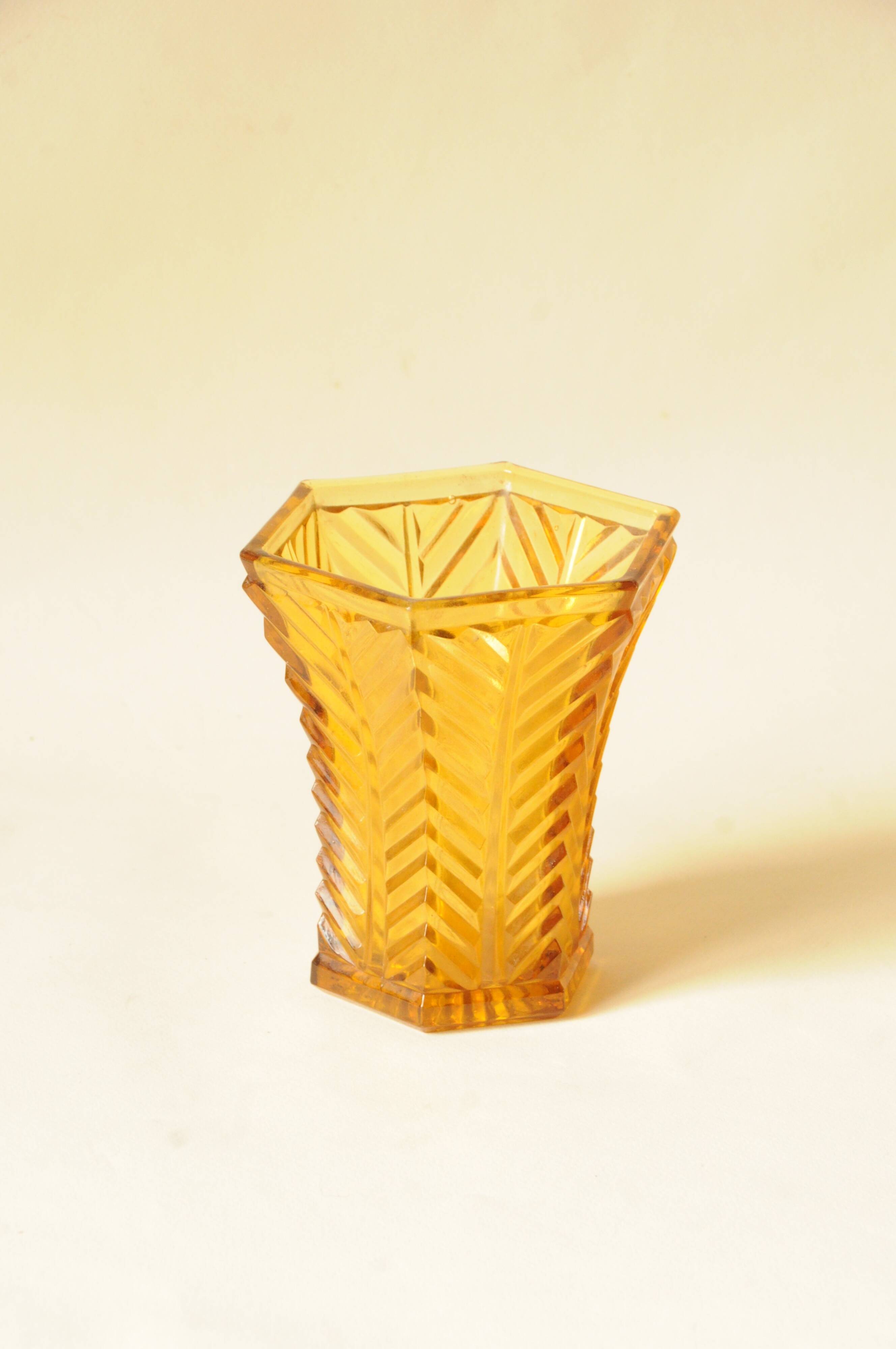 Vintage Art Deco vase in amber yellow cut glass with geometric design.