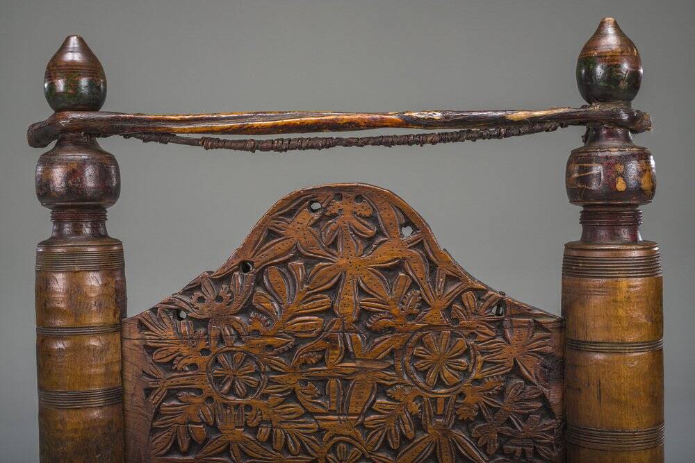 Early 20th century handmade low cedar chair, Nuristan, 1890s