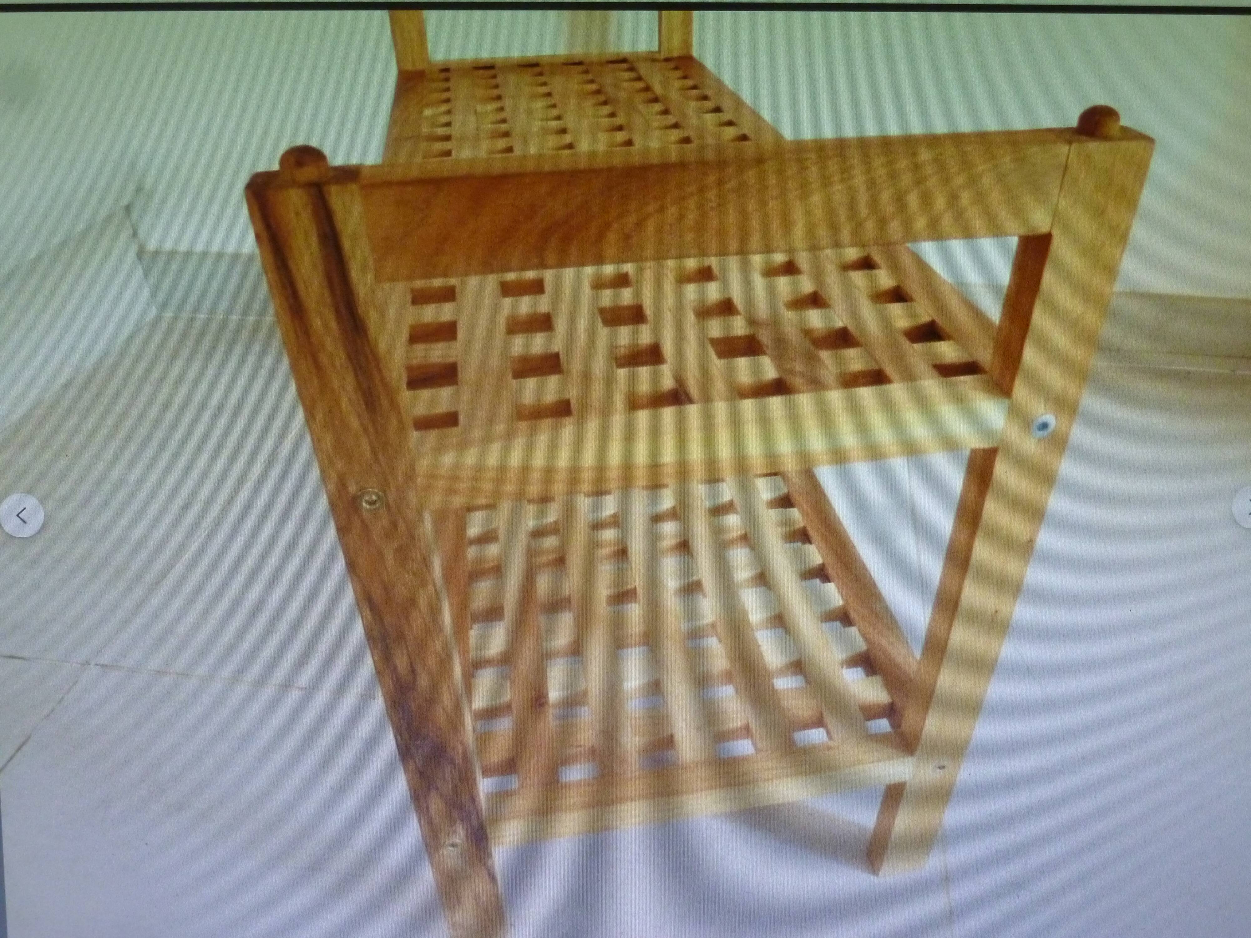 Wooden coffee table with openwork shelves and garden plant holder.