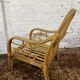 Fauteuil chauffeuse vintage en rotin des années 70