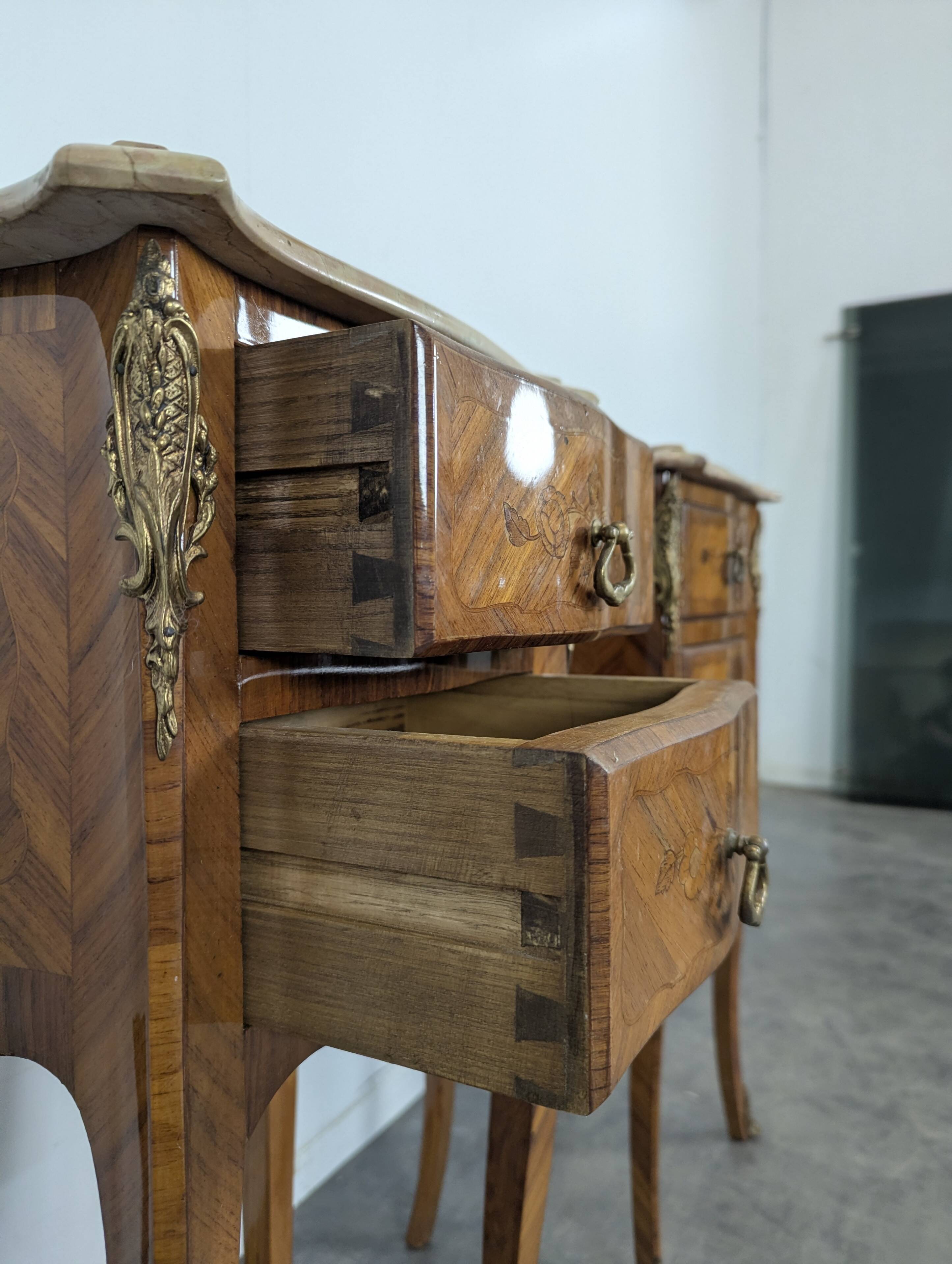 Pair of rosewood bedside tables in Louis XV style